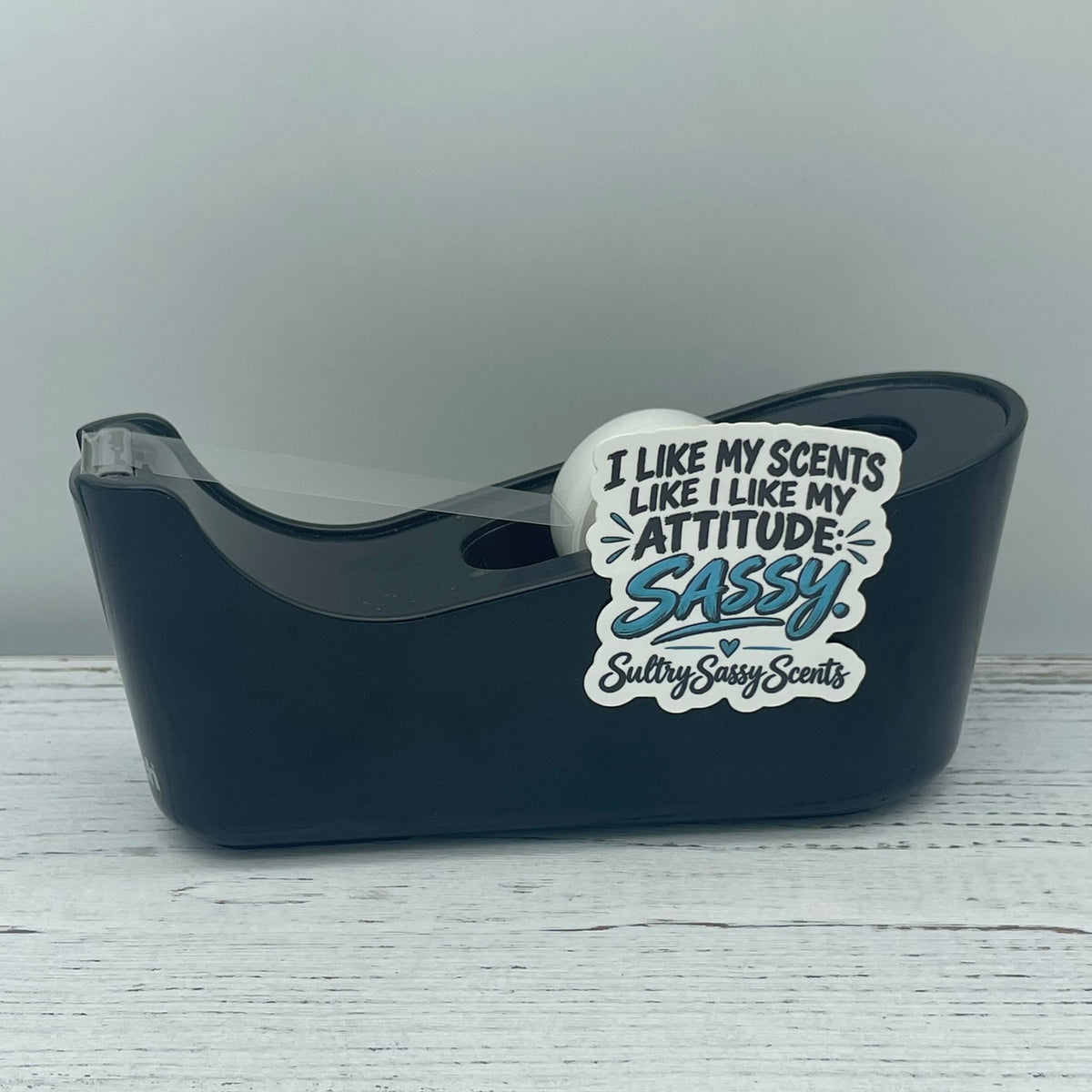 Sassy attitude vinyl sticker styled on a black office tape dispenser